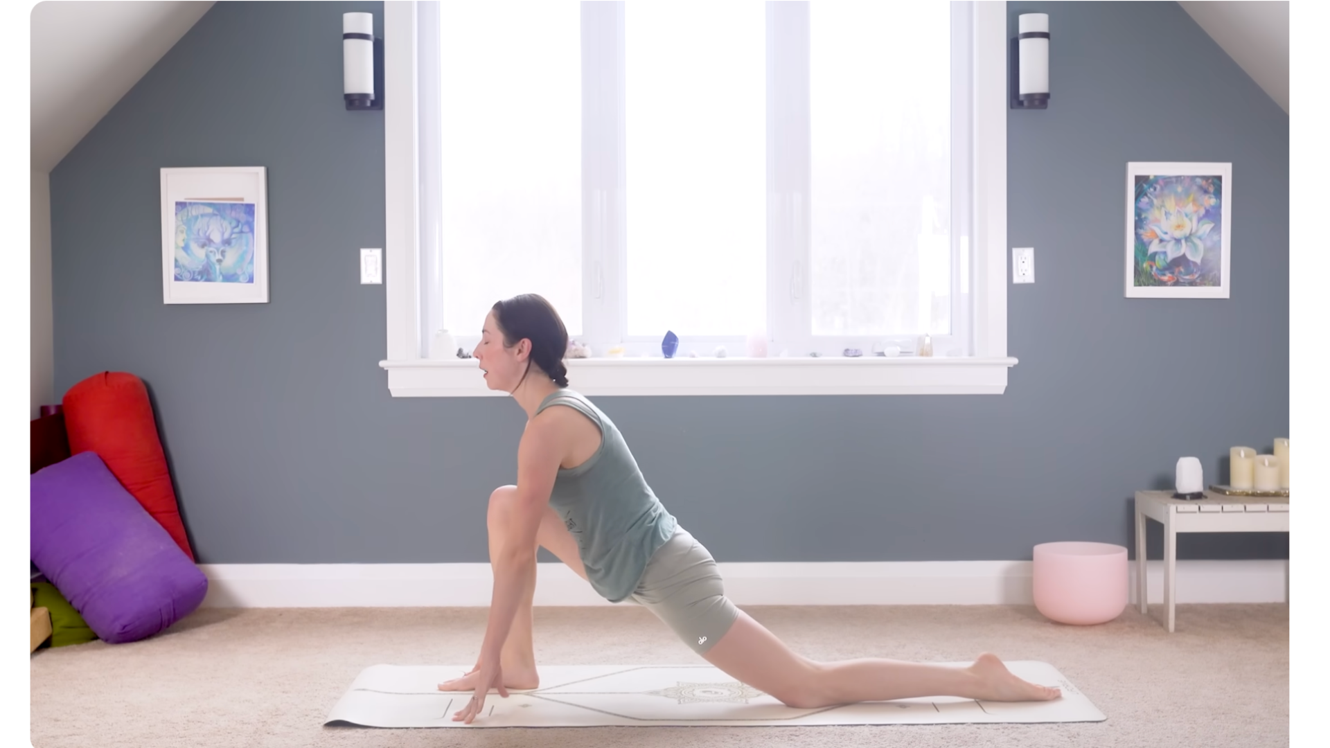 Woman kneeling on a mat in Low Lunge during a 15-minute morning yoga practice